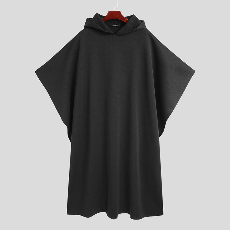 A male model wearing a black hooded Urban Wraith Street Cloak with a flowing silhouette.