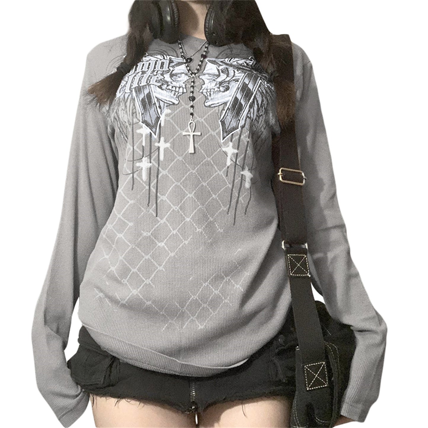 Gray hoodie with black graphics and cross details, worn by a person with a black backpack.