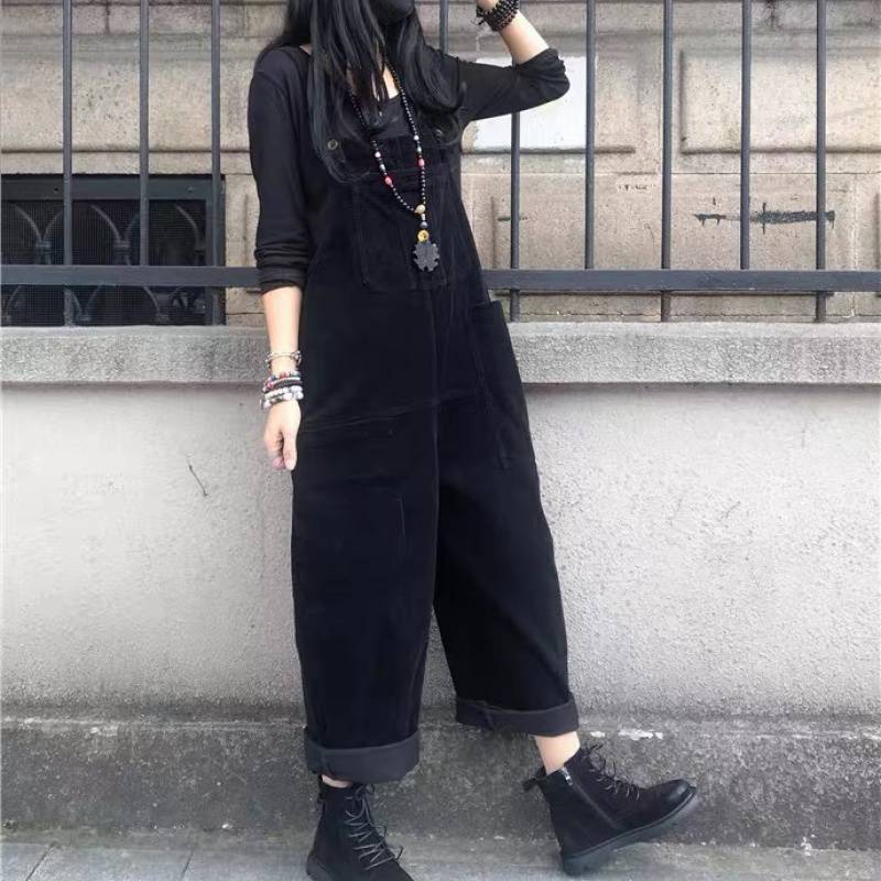 A corduroy dress with suspenders. A black dress, with retro-inspired designs.