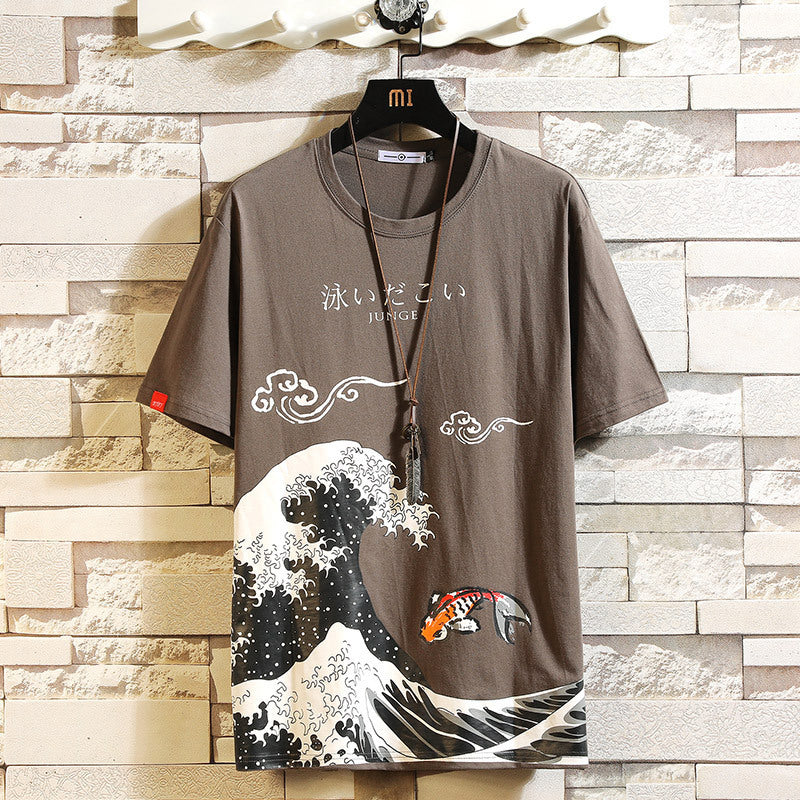 A brown Urban Flow Graphic Tee displayed on a mannequin, featuring a graphic print with waves and a fish.