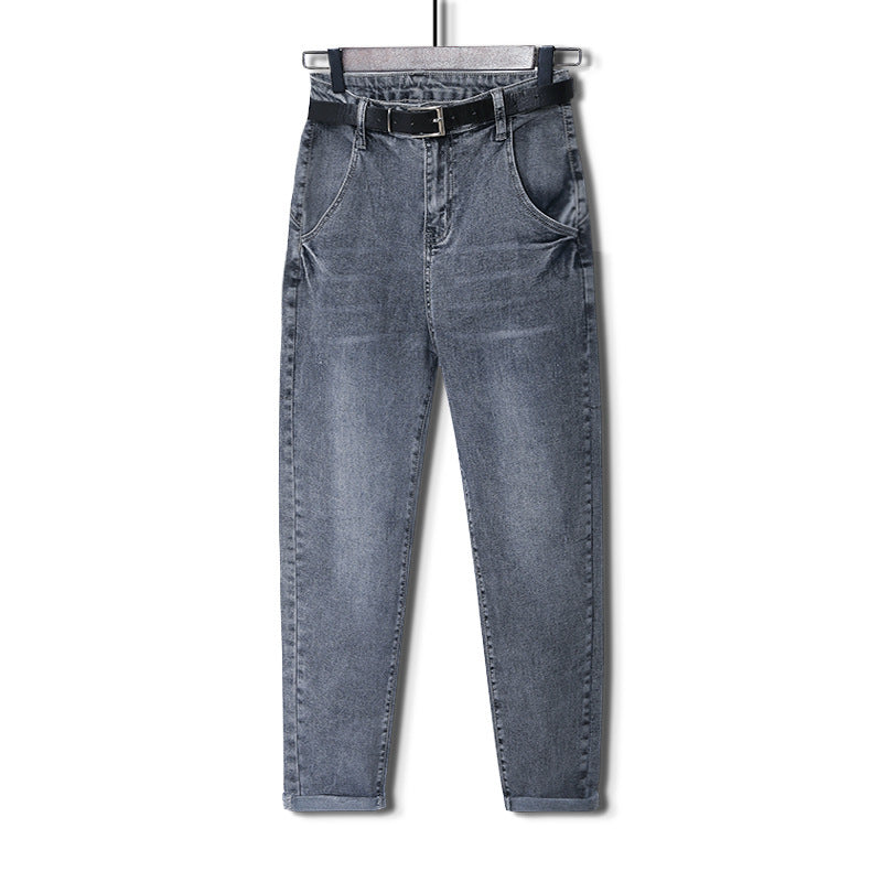 A pair of Timeless Classic Fit Men’s Denim Jeans in blue color, displayed on a hanger, featuring a retro Harlan wide leg design.