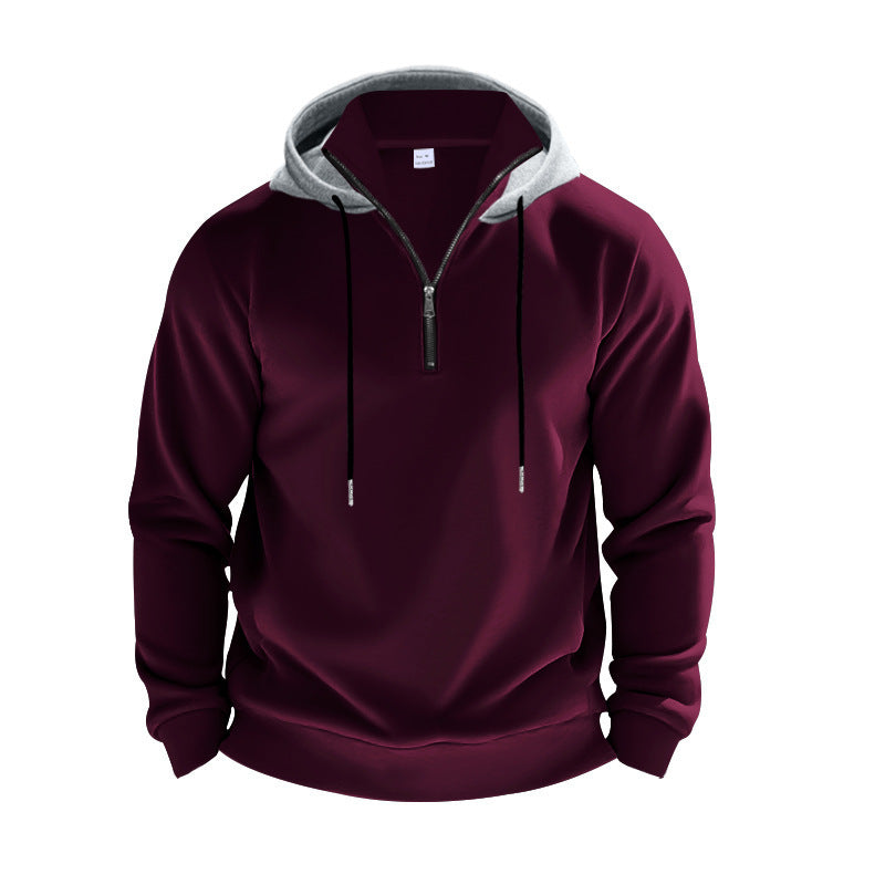 A maroon long sleeve pullover sweatshirt with a hood on a white background.