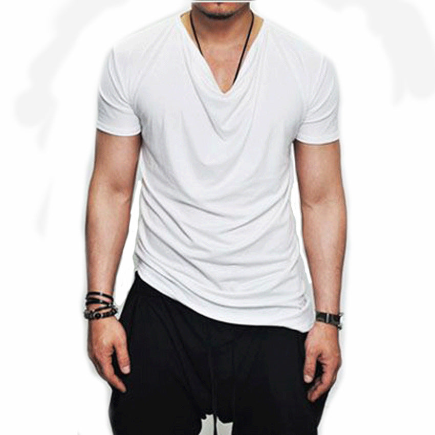A male model wearing a gray V-neck, short-sleeved T-shirt with a slim fit.