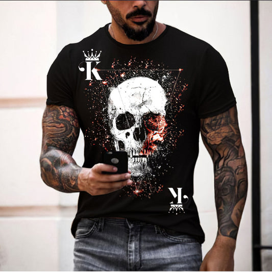 A person wearing a black t-shirt with a 3D digital print of a skull in the center, with splashes of red and white around it.