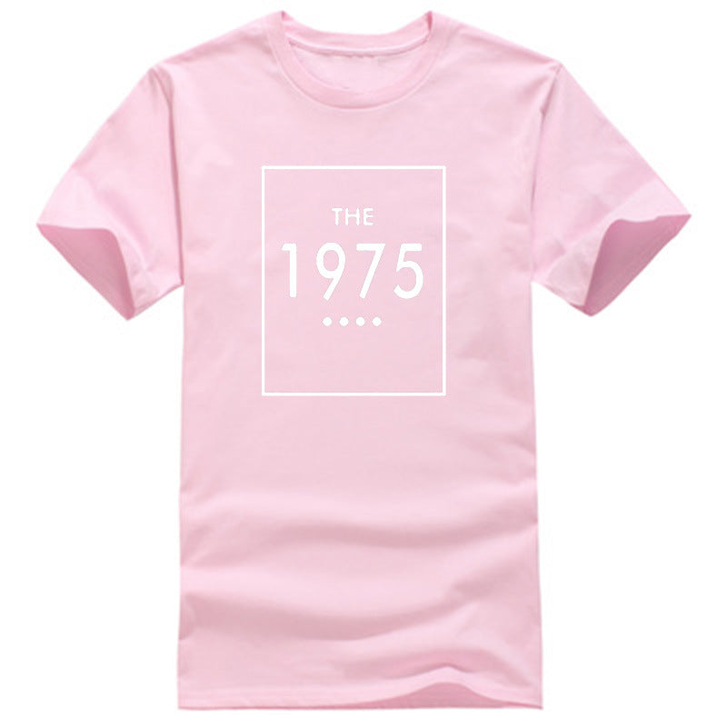 A pink oversized t-shirt with 'THE 1975' printed in black lettering on the front.