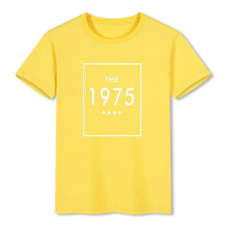 A yellow oversized t-shirt with 'THE 1975' printed in black lettering on the front.