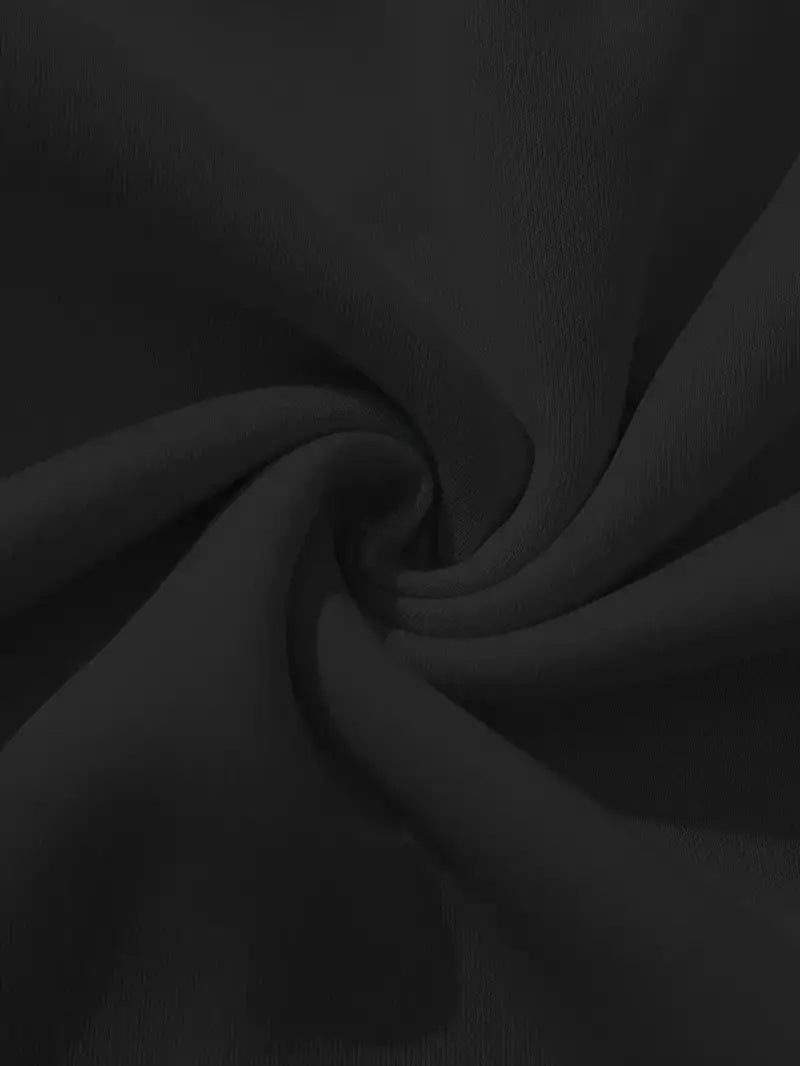 Close-up of black fabric with folds