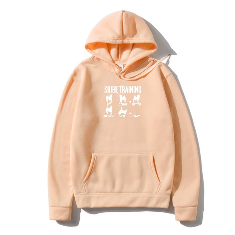 A beige hoodie with 'URBAN TRAINER' text and illustrations of dogs on the front.
