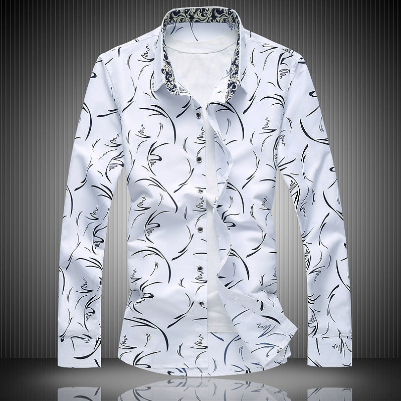 A navy blue long-sleeved shirt with a floral design and a square collar, displayed against a dark textured background.