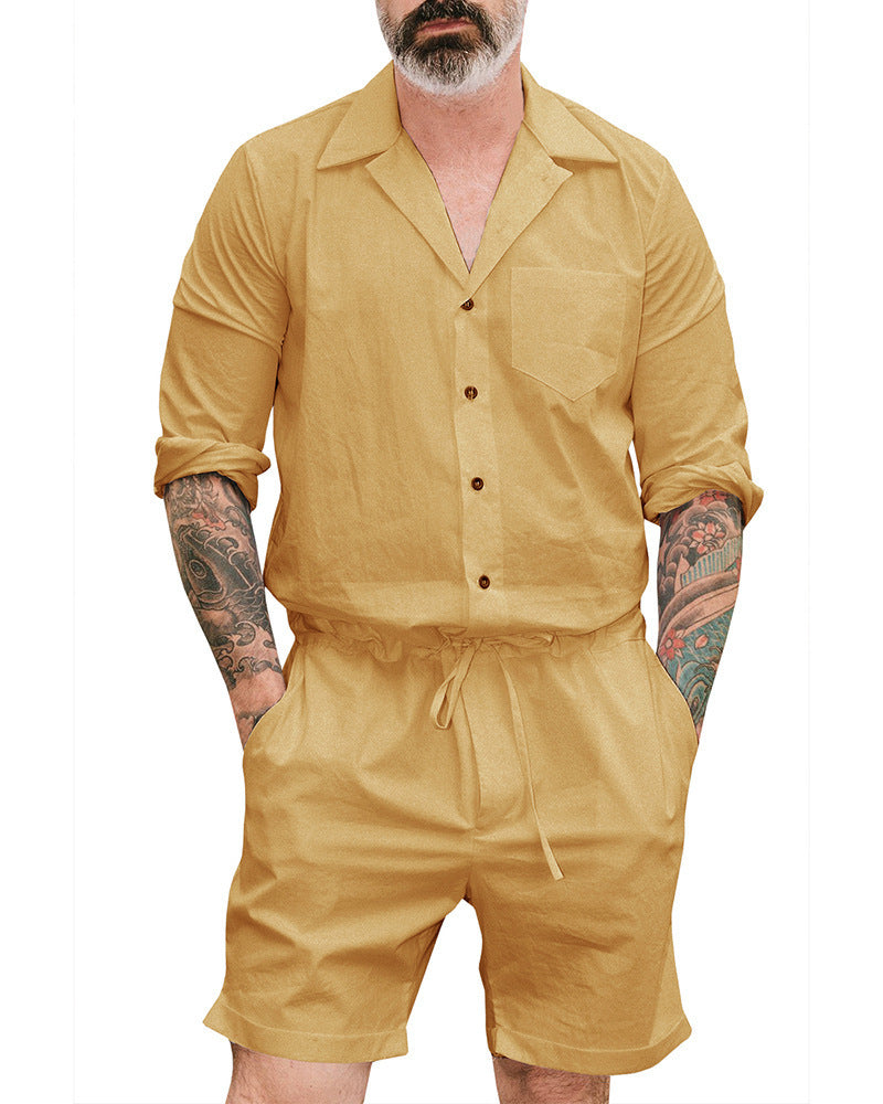 A man wearing a yellow short-sleeved button-up bodysuit with a collar and drawstring waist.