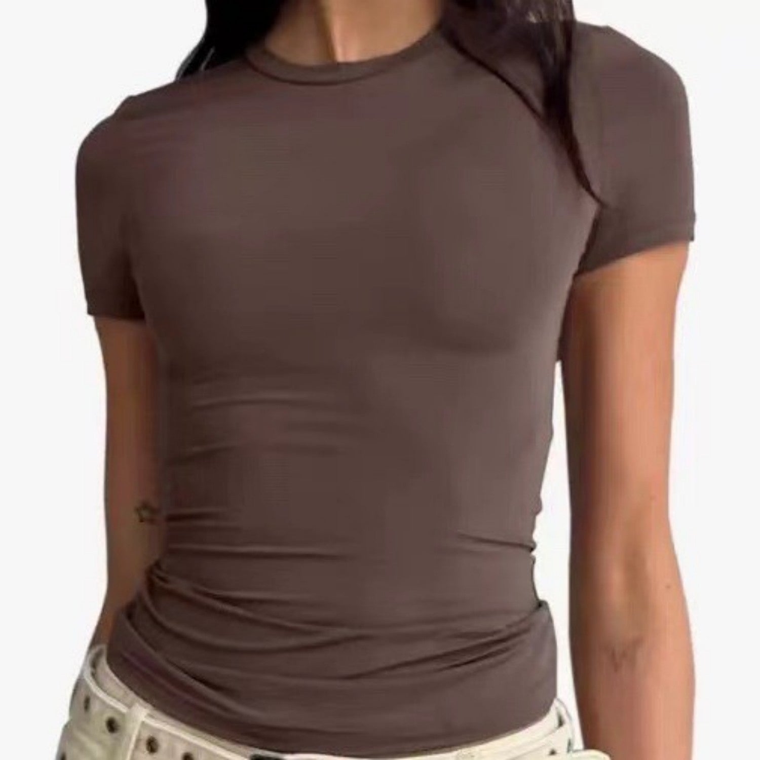 A woman wearing a brown Urban Core Layer Tee with a round neckline and short sleeves.