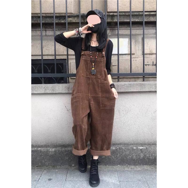 A corduroy dress with suspenders. A black dress, with retro-inspired designs.