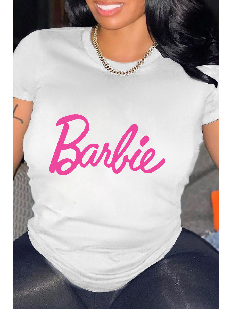 A person wearing a white relaxed fit t-shirt with the pink 'Barbie' text graphic printed on the front.