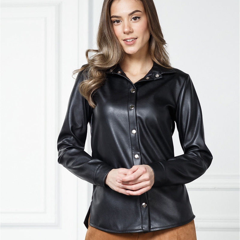 A woman wearing a black faux leather button-down shirt with long sleeves.