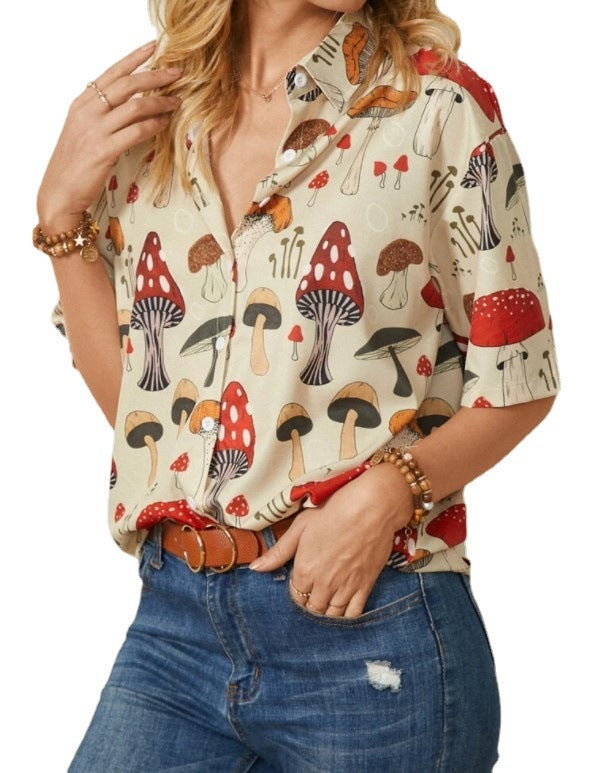 A woman wearing a yellow Urban Casual Lapel Shirt with a mushroom print, paired with blue jeans and a brown belt.