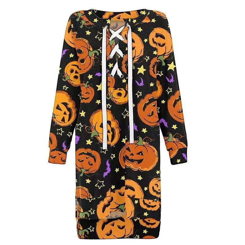 Halloween-themed dress with pumpkins and stars on a black background