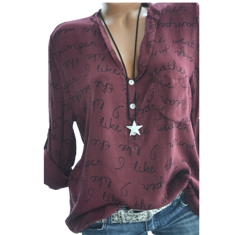 A plus-sized red shirt with a relaxed fit, featuring a printed pattern and a pullover style. The shirt is displayed on a model mannequin.