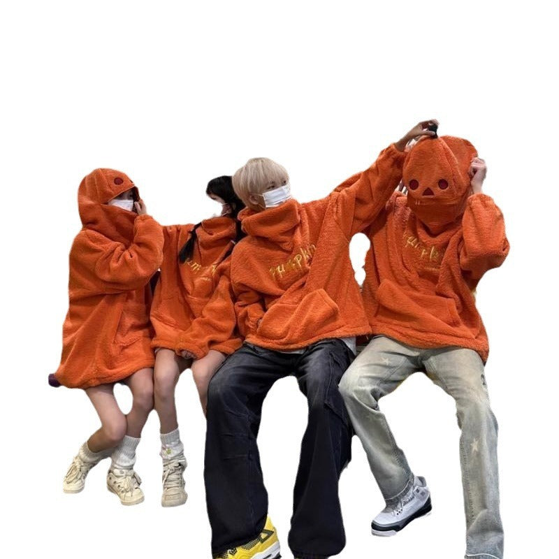 Four people wearing matching orange hoodies on a white background