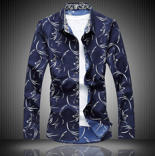 A navy blue long-sleeved shirt with a floral design and a square collar, displayed against a dark textured background.