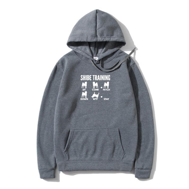 A gray hoodie with 'URBAN TRAINER' text and illustrations of dogs on the front.