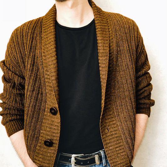 A person wearing a brown Urban Knit V-Neck Cardigan over a black t-shirt and blue jeans.