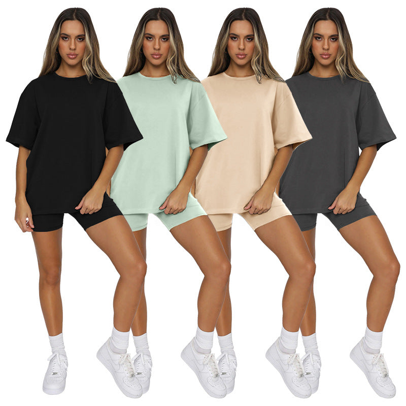 Four women modeling the Urban Breeze Round Neck Pullover in different colors: black, green, beige, and gray.
