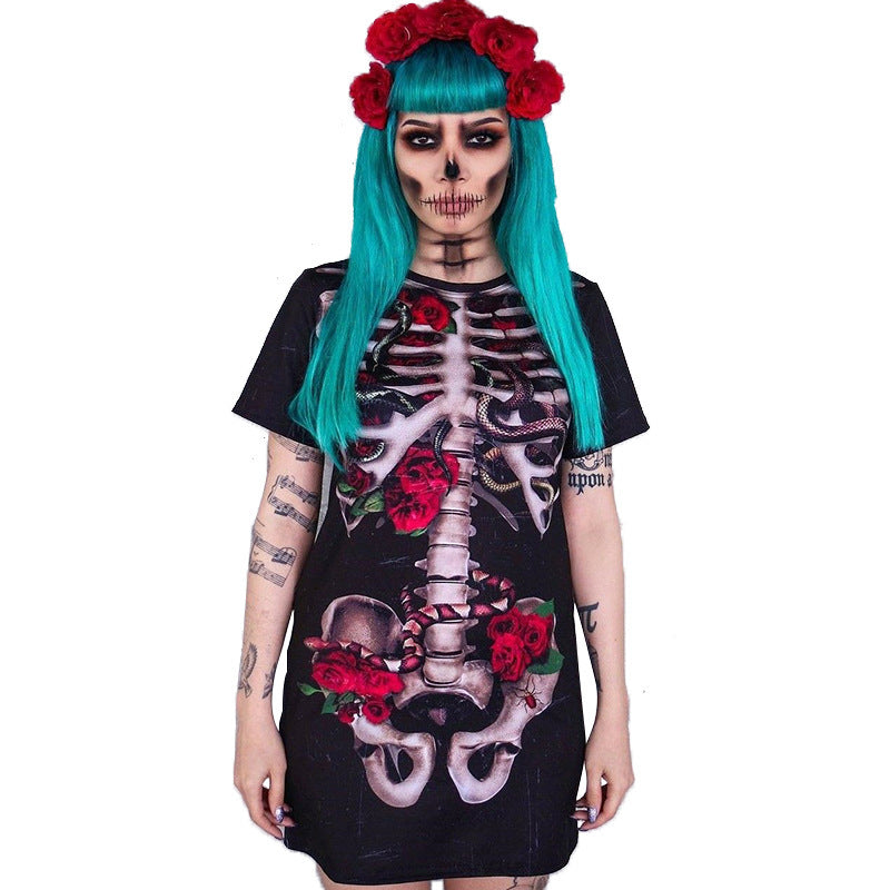 Person wearing a black dress with skeleton and floral design, turquoise hair with red flowers, and tattoos.