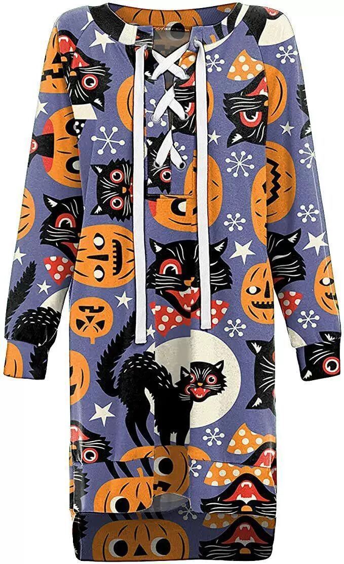 Halloween-themed outfit with cats and pumpkins on a blue background