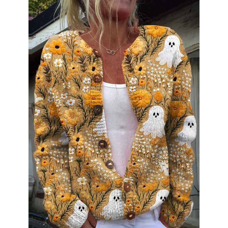 Person wearing a floral and ghost patterned cardigan with a blurred face.
