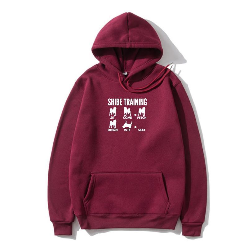 A maroon hoodie with 'URBAN TRAINER' text and illustrations of dogs on the front.