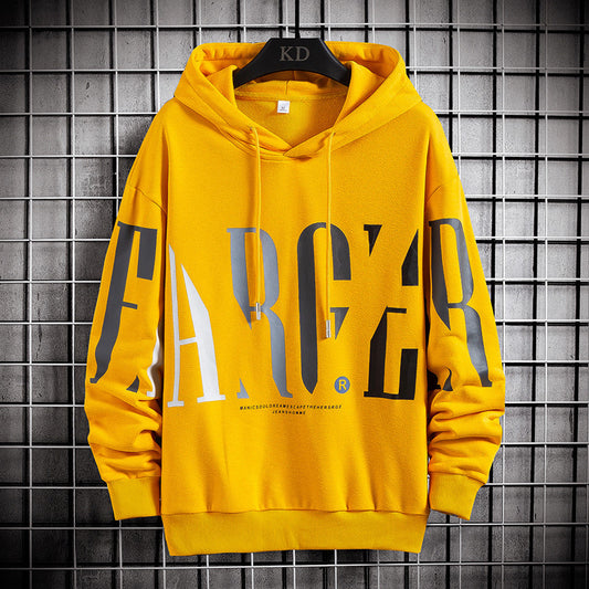 A yellow hooded pullover with bold black letter print, displayed on a hanger against a grey tiled background.