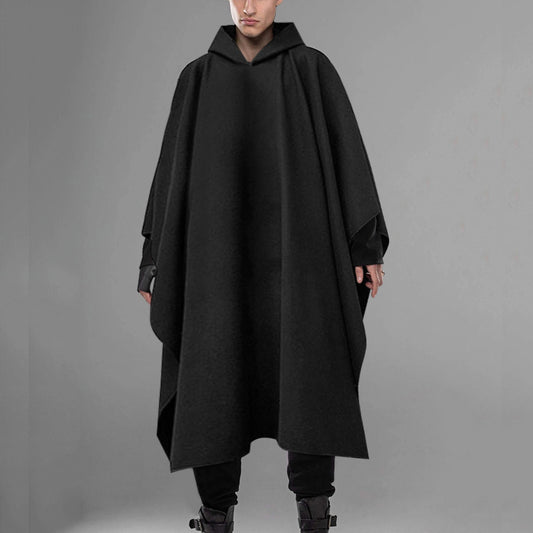 A male model wearing a black hooded Urban Wraith Street Cloak with a flowing silhouette.
