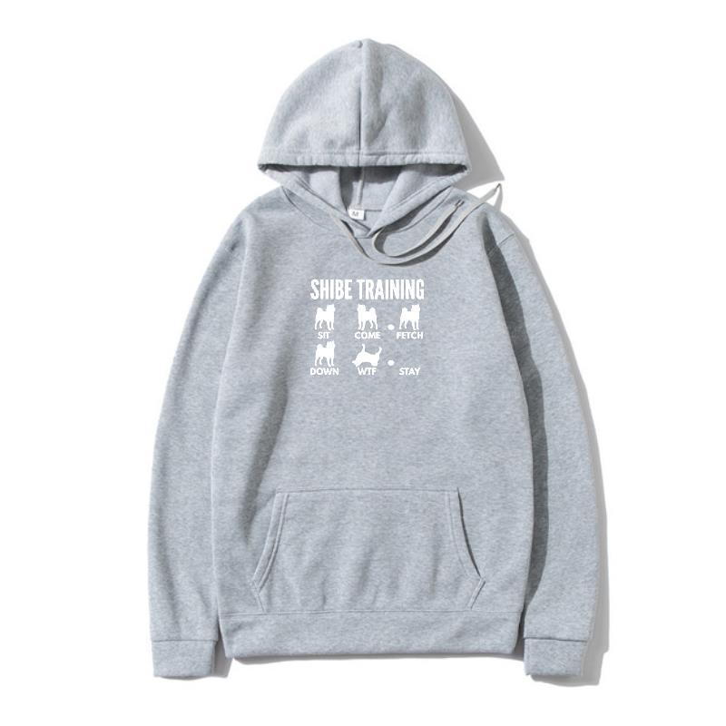 A gray hoodie with 'URBAN TRAINER' text and illustrations of dogs on the front.