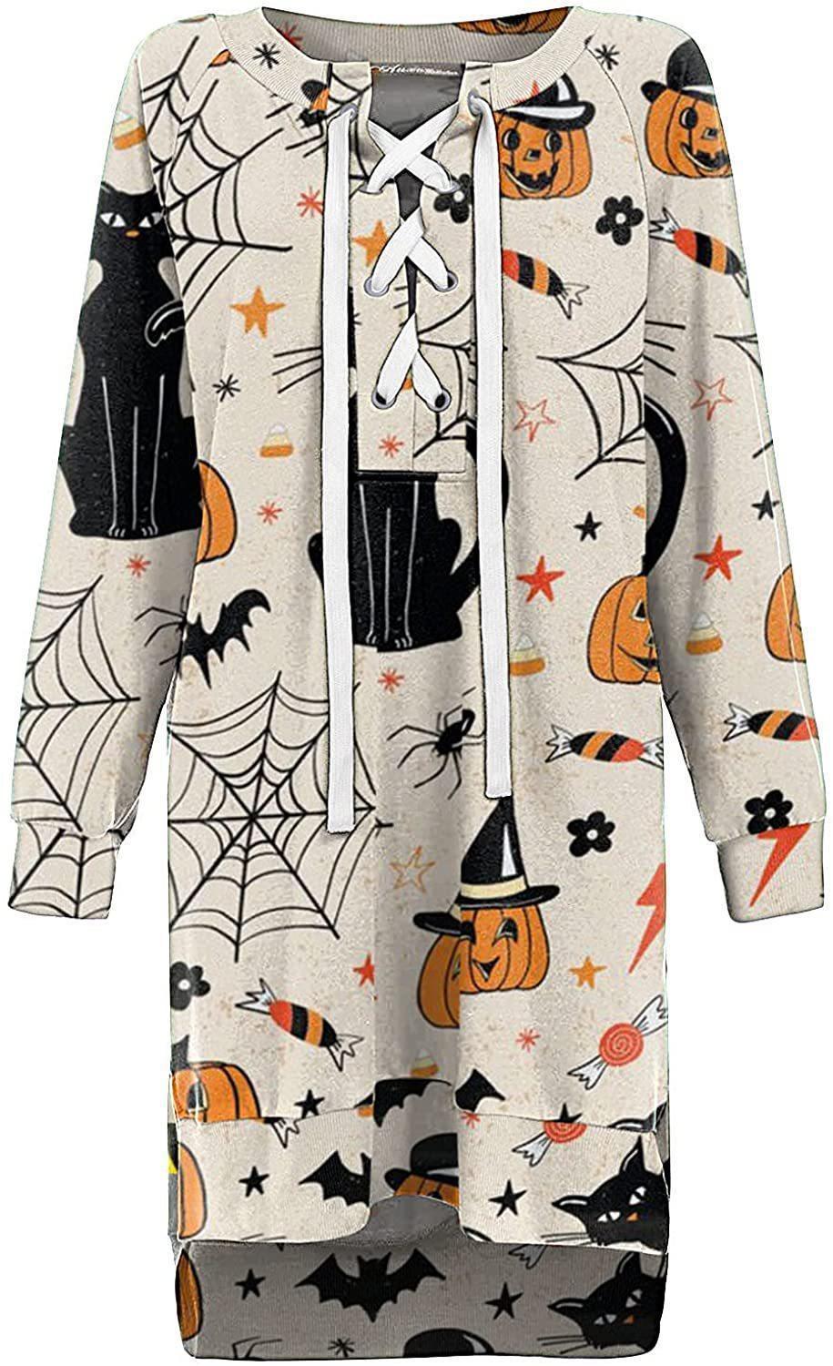 Halloween-themed onesie with pumpkins, cats, and candy corn on a white background