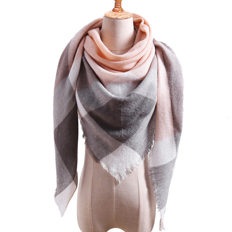 A triangular plaid cashmere wrap in gray, black, and beige, displayed on a mannequin bust.