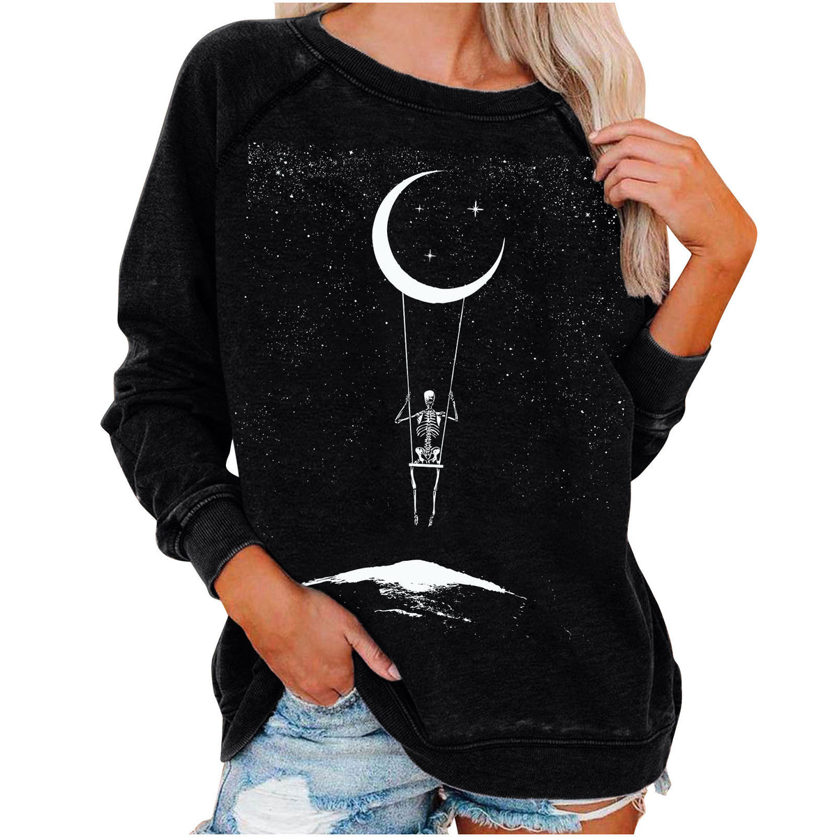 Black sweatshirt with skeleton and moon design worn by a person on a white background