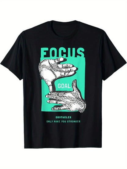 Black t-shirt with graphic design of hands and motivational text on a white background