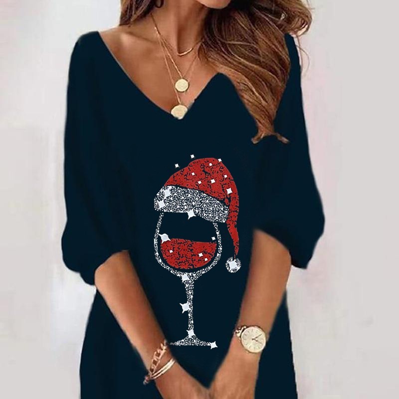 Black sweater with a festive wine glass design on a plain background