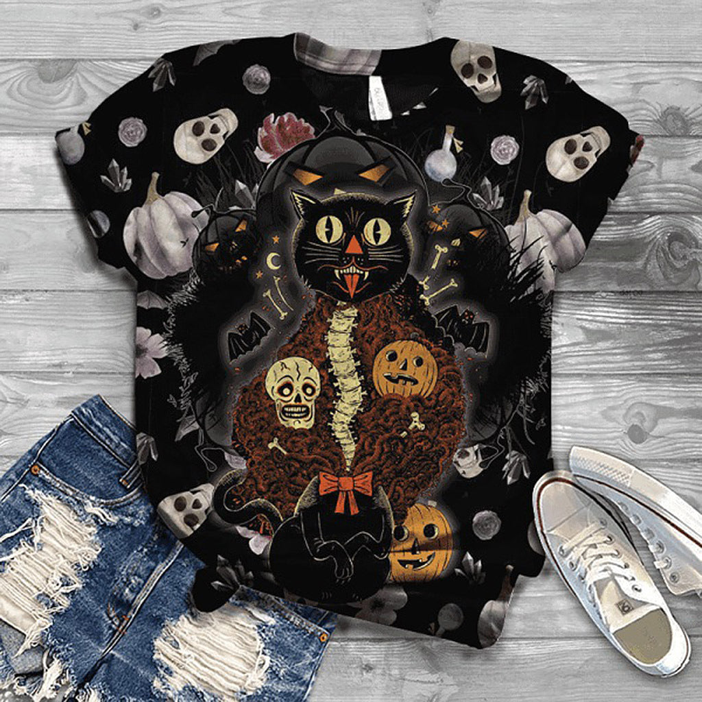 Black t-shirt with Halloween-themed design featuring a cat, pumpkins, and skeletons on a wooden surface.