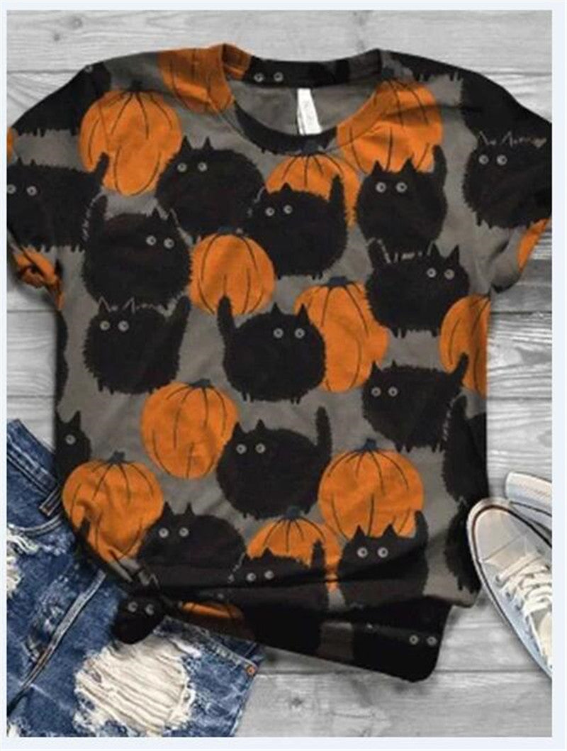 T-shirt with Halloween-themed design of black cats and orange pumpkins on a gray background.