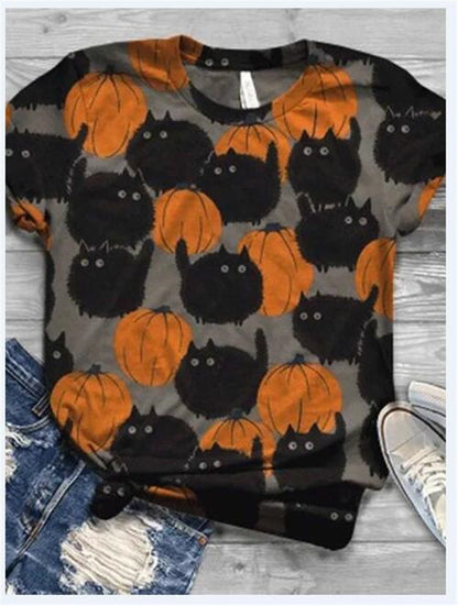 T-shirt with Halloween-themed design of black cats and orange pumpkins on a gray background.