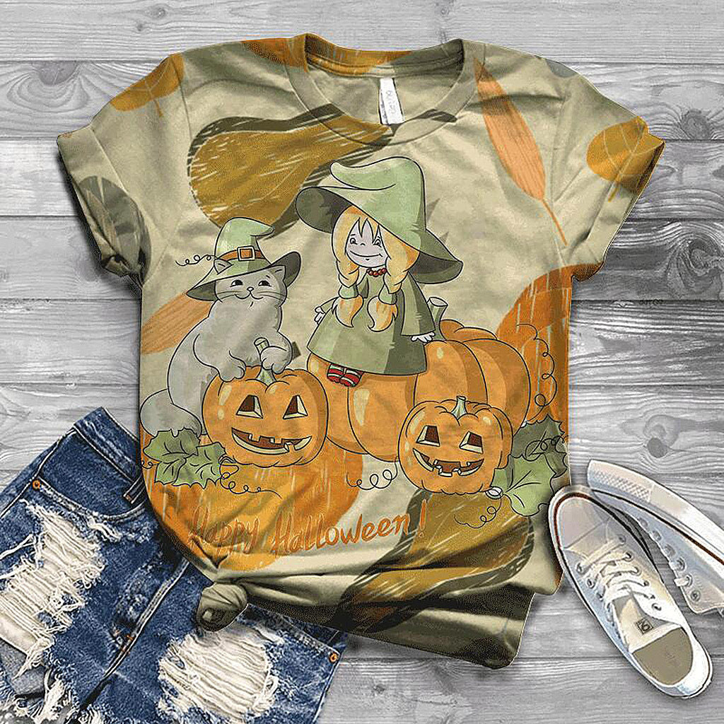 Halloween-themed t-shirt with pumpkins and cats on a wooden surface with jeans and shoes.