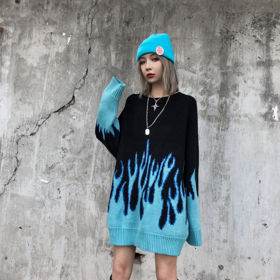 Two individuals wearing black sweatshirts with a blue flame pattern, viewed from the back