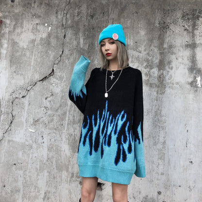 Two individuals wearing black sweatshirts with a blue flame pattern, viewed from the back