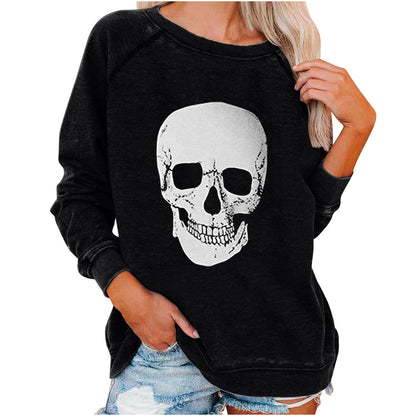 Black sweatshirt with a skull design worn by a person on a white background