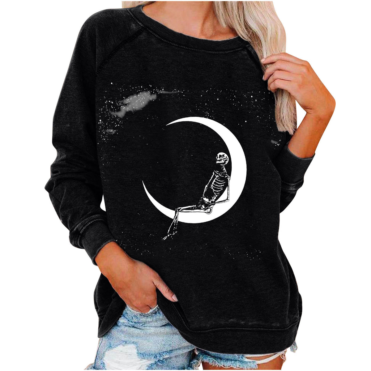 Black sweatshirt with skeleton on a crescent moon design, worn by a person.