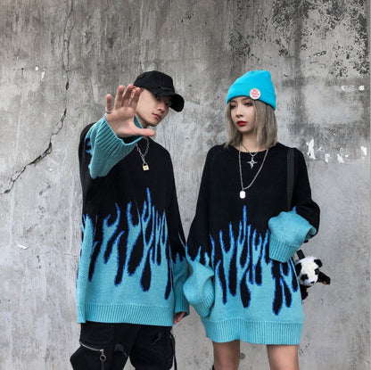 Two individuals wearing black sweatshirts with a blue flame pattern, viewed from the back