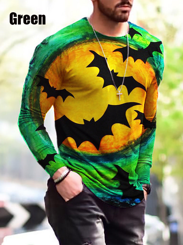 Person wearing a green, yellow, and black tie-dye long-sleeve shirt with bat designs.