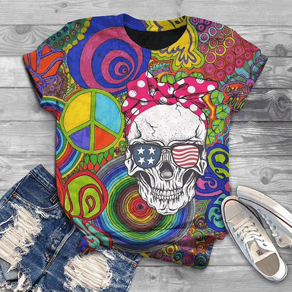 Colorful t-shirt with skull and peace symbol design on a wooden surface