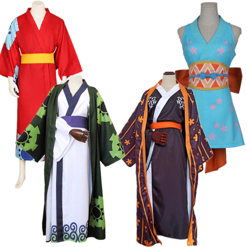 Collection of colorful traditional outfits on mannequins against a white background
